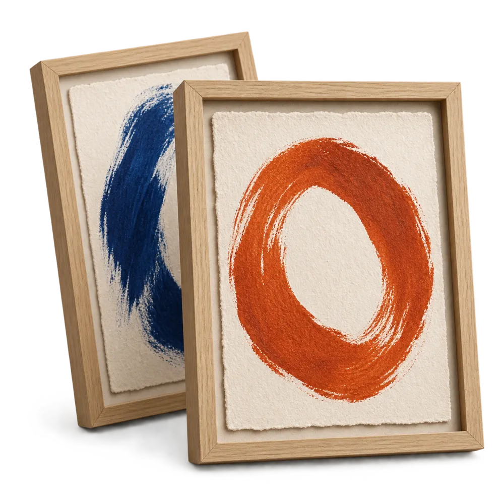 Two framed brush paintings, a blue one and a terracotta circle.